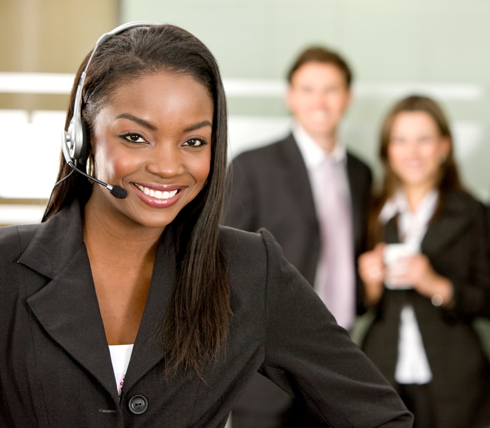 business customer support operator woman smiling in an office business customer support operator woman smiling in an office